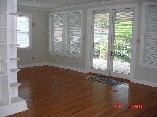 360 Vinet Ave, Jefferson, LA 70121 - entryway featuring baseboards, wood finished floors, and ornamental molding