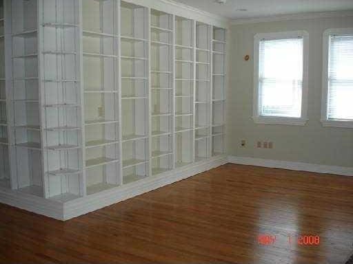 360 Vinet Ave, Jefferson, LA 70121 - unfurnished room featuring wood finished floors, crown molding, and baseboards