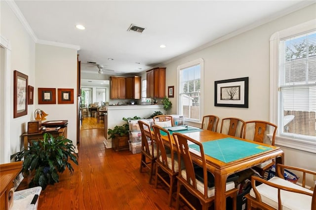 360 Vinet Ave, Jefferson, LA 70121 - dining area with ornamental molding, dark wood-style flooring, and recessed lighting