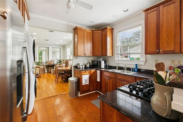 360 Vinet Ave, Jefferson, LA 70121 - kitchen featuring smart refrigerator, light wood finished floors, plenty of natural light, crown molding, and brown cabinetry