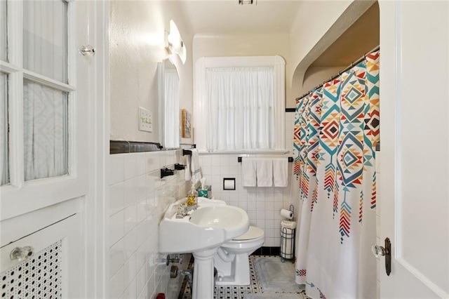 360 Vinet Ave, Jefferson, LA 70121 - full bath with tile walls, a shower with curtain, tile patterned floors, and a wainscoted wall