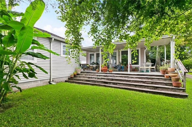 360 Vinet Ave, Jefferson, LA 70121 - back of property with a lawn and a wooden deck