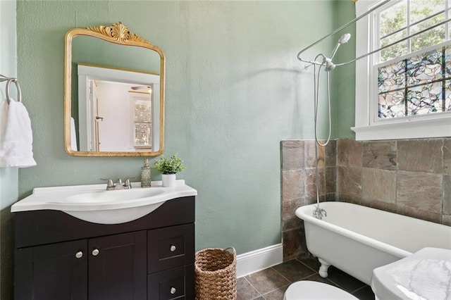 3221 N Rampart St Unit 3221, New Orleans, LA 70117 - full bath with a soaking tub, baseboards, tile patterned floors, vanity, and toilet