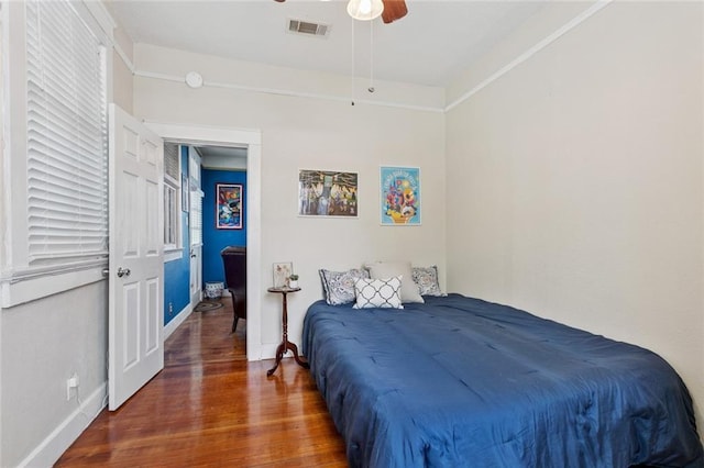 3221 N Rampart St Unit 3221, New Orleans, LA 70117 - bedroom with wood finished floors, baseboards, and a ceiling fan