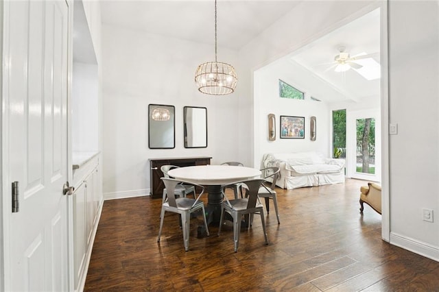 103 Catalpa Ln Unit 231, Mandeville, LA 70471 - dining area featuring lofted ceiling, ceiling fan, baseboards, dark wood-type flooring, and a chandelier