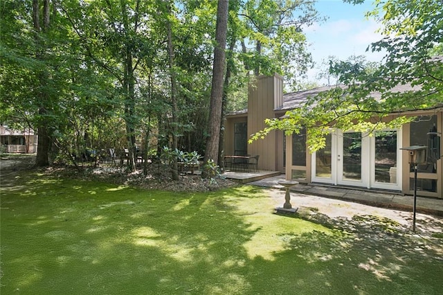 103 Catalpa Ln Unit 231, Mandeville, LA 70471 - view of grassy yard featuring french doors