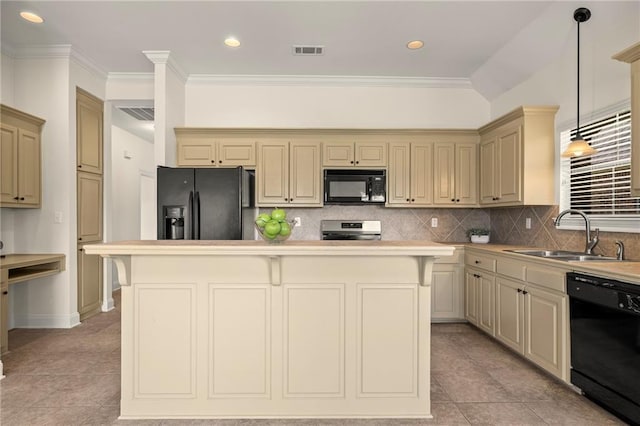 3346 Southlake Ave, Baton Rouge, LA 70818 - kitchen featuring black appliances, a sink, cream cabinetry, a kitchen island, and decorative backsplash