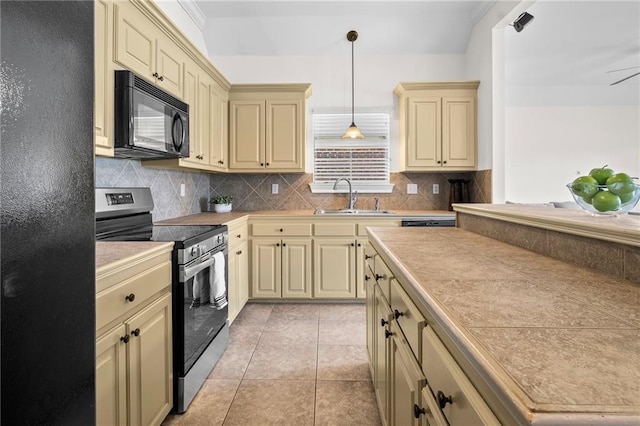 3346 Southlake Ave, Baton Rouge, LA 70818 - kitchen featuring cream cabinetry, black appliances, a sink, backsplash, and pendant lighting