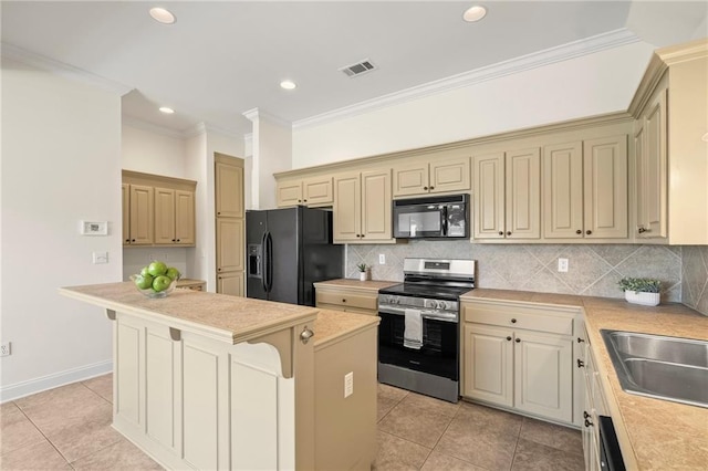 3346 Southlake Ave, Baton Rouge, LA 70818 - kitchen with black appliances, light countertops, light tile patterned floors, crown molding, and a kitchen island