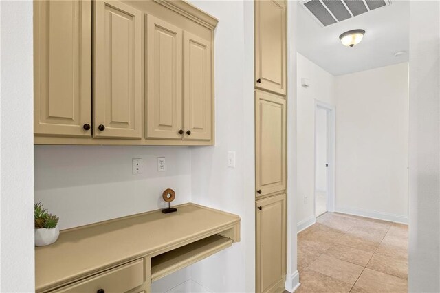 3346 Southlake Ave, Baton Rouge, LA 70818 - kitchen featuring cream cabinets, baseboards, and light countertops