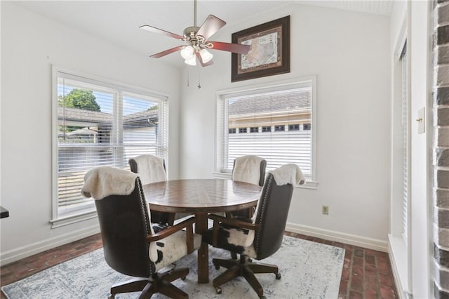 41 Yellowstone Dr, New Orleans, LA 70131 - dining area featuring baseboards, brick flooring, a ceiling fan, and vaulted ceiling