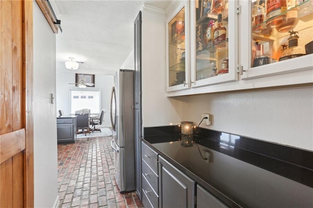 41 Yellowstone Dr, New Orleans, LA 70131 - indoor bar featuring brick flooring, freestanding refrigerator, and ornamental molding