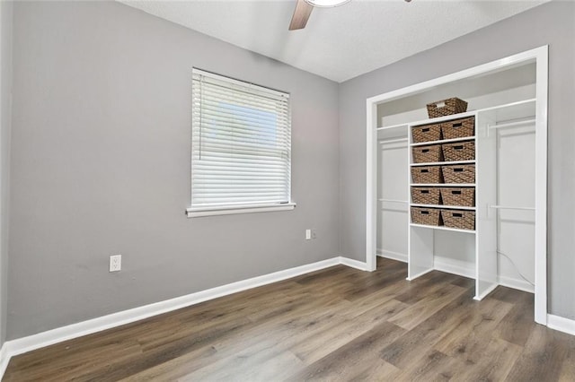 38 Gretna Blvd, Gretna, LA 70053 - unfurnished bedroom with wood finished floors, baseboards, a closet, and a ceiling fan