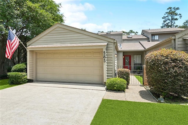 585 Beau Chene Dr, Mandeville, LA 70471 - view of front of house with an attached garage