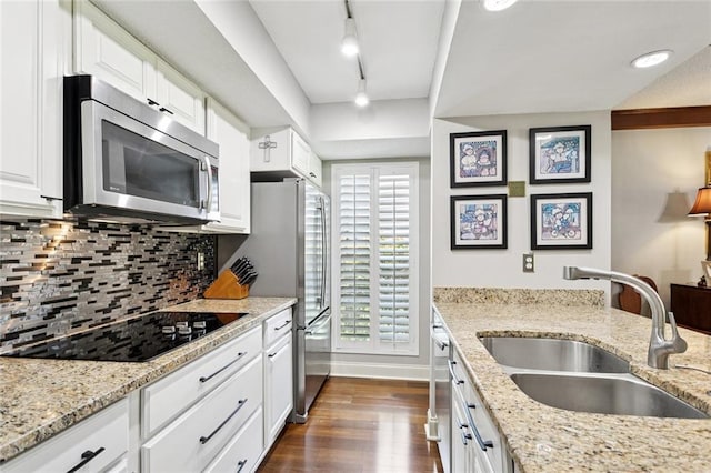 585 Beau Chene Dr, Mandeville, LA 70471 - kitchen featuring stainless steel appliances, a sink, dark wood finished floors, backsplash, and white cabinetry