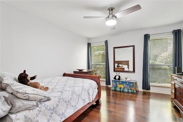585 Beau Chene Dr, Mandeville, LA 70471 - bedroom featuring dark wood-style flooring, baseboards, and a ceiling fan