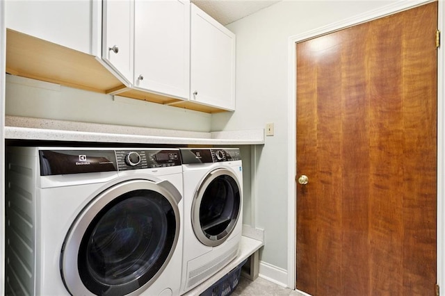 585 Beau Chene Dr, Mandeville, LA 70471 - laundry room featuring washer and clothes dryer and cabinet space