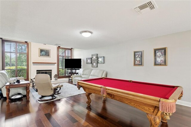 585 Beau Chene Dr, Mandeville, LA 70471 - game room featuring wood finished floors, a brick fireplace, and billiards
