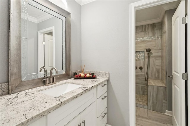 2018 Old River Rd, Slidell, LA 70461 - full bath with crown molding, vanity, a tile shower, and baseboards