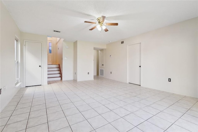 5175 Westgrove Park, New Orleans, LA 70131 - unfurnished room with a ceiling fan and stairs