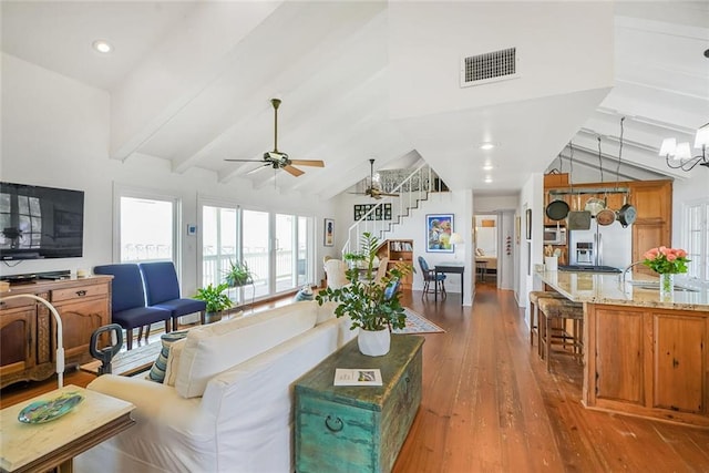 329 Carr Dr, Slidell, LA 70458 - living room featuring a ceiling fan, hardwood / wood-style floors, and a chandelier