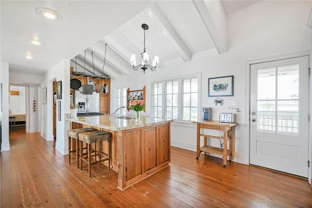 329 Carr Dr, Slidell, LA 70458 - kitchen featuring stainless steel refrigerator with ice dispenser, hardwood / wood-style flooring, a chandelier, light stone counters, and recessed lighting