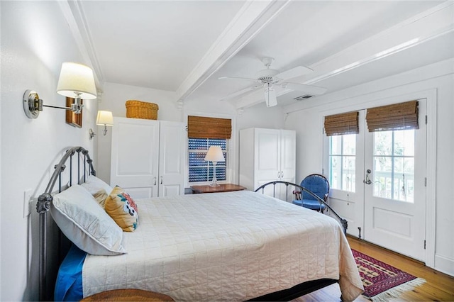 329 Carr Dr, Slidell, LA 70458 - bedroom featuring french doors, wood finished floors, beam ceiling, and ceiling fan