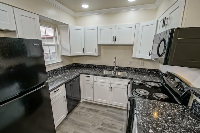 2500 Houma Blvd Unit 202, Metairie, LA 70001 - kitchen featuring black appliances, a sink, crown molding, dark stone counters, and white cabinetry