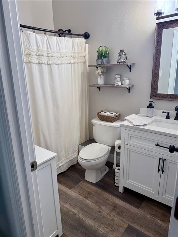 246 Betty Dr, Montz, LA 70068 - bathroom featuring vanity, toilet, wood finished floors, and a shower with curtain