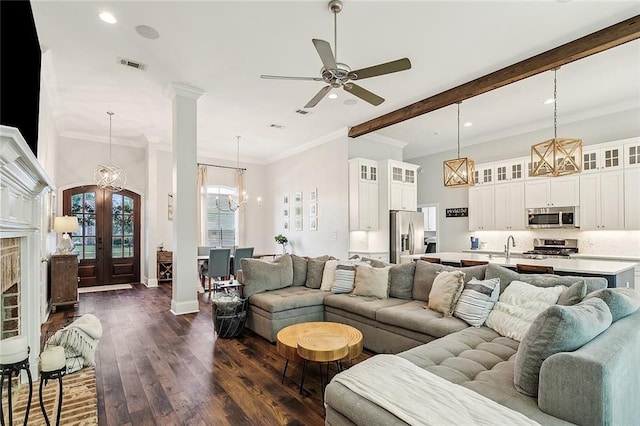668 Highlands Dr, Slidell, LA 70458 - living area featuring recessed lighting, a chandelier, french doors, dark wood-style flooring, and crown molding
