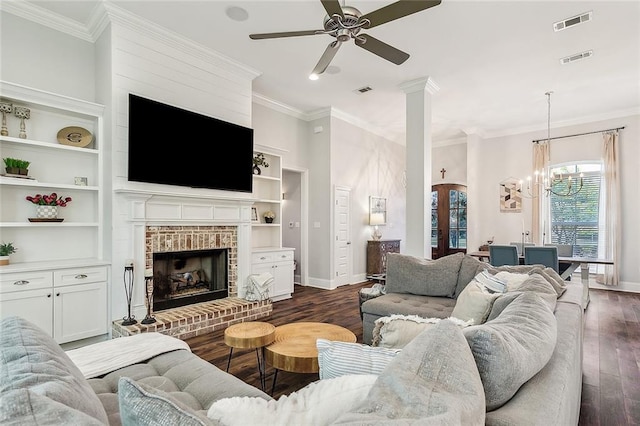 668 Highlands Dr, Slidell, LA 70458 - living room with dark wood finished floors, a ceiling fan, crown molding, baseboards, and a chandelier