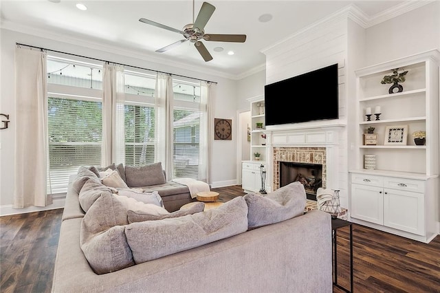 668 Highlands Dr, Slidell, LA 70458 - living area with crown molding, a fireplace, a ceiling fan, dark wood-type flooring, and baseboards