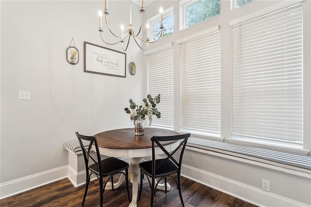 668 Highlands Dr, Slidell, LA 70458 - dining space with baseboards, dark wood-style flooring, and a chandelier