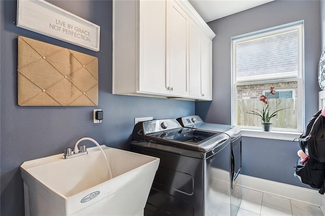 668 Highlands Dr, Slidell, LA 70458 - washroom with washing machine and clothes dryer and cabinet space