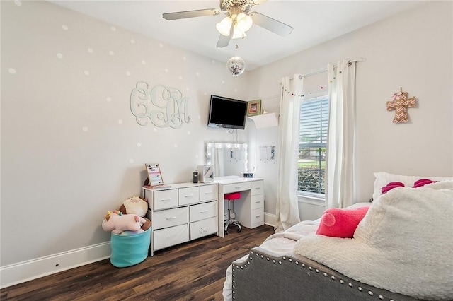 668 Highlands Dr, Slidell, LA 70458 - bedroom featuring dark wood finished floors, baseboards, a desk, and ceiling fan