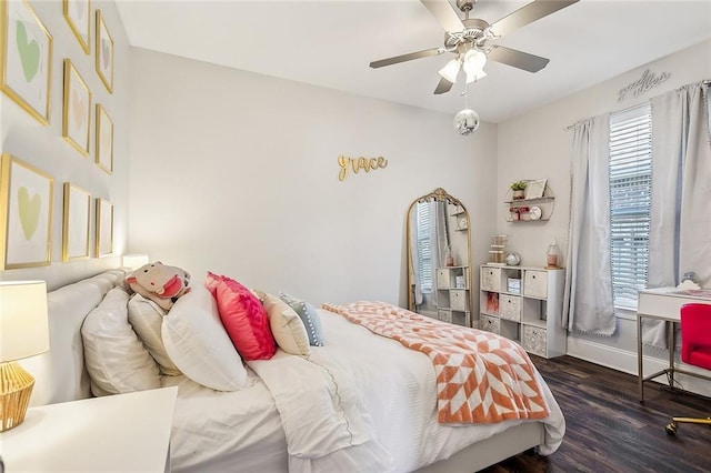 668 Highlands Dr, Slidell, LA 70458 - bedroom with wood finished floors, baseboards, and ceiling fan