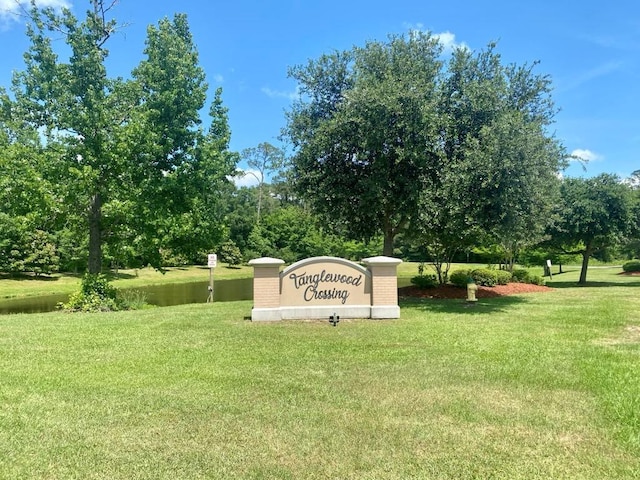 668 Highlands Dr, Slidell, LA 70458 - community sign with a lawn and a water view