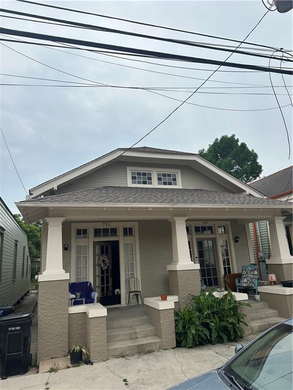 70911 Evelina St, New Orleans, LA 70114 - view of front of home with a porch and roof with shingles