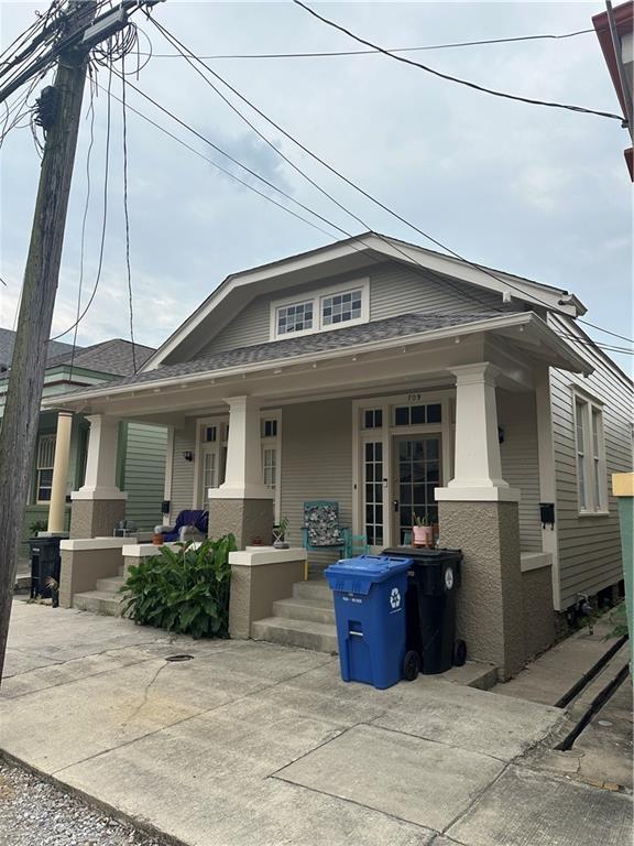 70911 Evelina St, New Orleans, LA 70114 - view of front of house featuring covered porch
