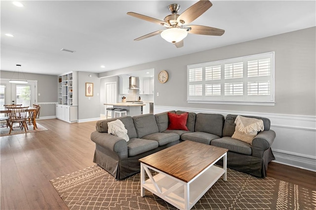 1924 Cammie Ave, Metairie, LA 70003 - living room featuring wood finished floors, ceiling fan, recessed lighting, and baseboards