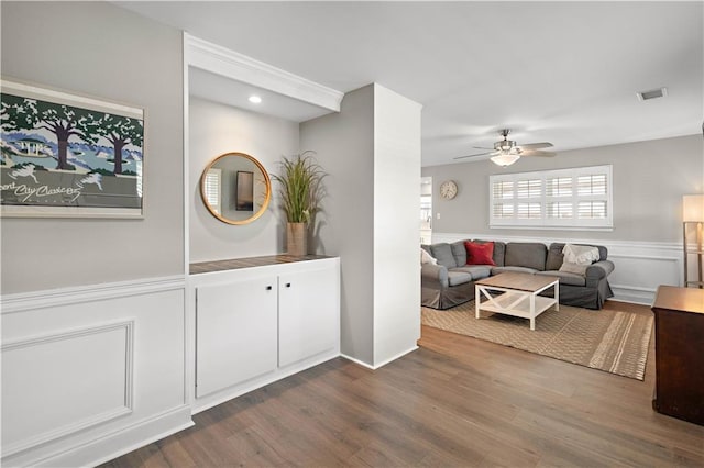 1924 Cammie Ave, Metairie, LA 70003 - living room with wood finished floors, a ceiling fan, wainscoting, and a decorative wall