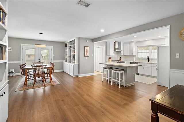 1924 Cammie Ave, Metairie, LA 70003 - dining area featuring healthy amount of natural light, wood finished floors, and recessed lighting