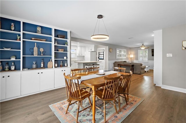1924 Cammie Ave, Metairie, LA 70003 - dining area featuring wood finished floors, ceiling fan, and baseboards