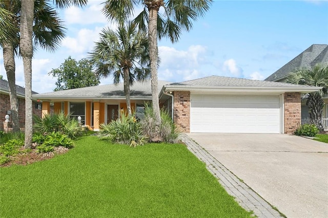 118 Weatherly Cv, Slidell, LA 70458 - ranch-style house with an attached garage, concrete driveway, brick siding, and a front yard