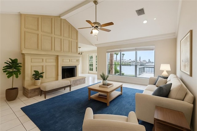 118 Weatherly Cv, Slidell, LA 70458 - living room with light tile patterned floors, ceiling fan, a large fireplace, beamed ceiling, and baseboards