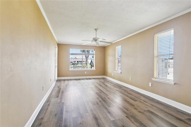 118 Weatherly Cv, Slidell, LA 70458 - spare room with ornamental molding, a textured ceiling, a ceiling fan, wood finished floors, and baseboards