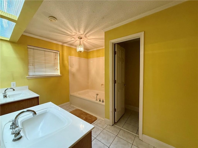 118 Weatherly Cv, Slidell, LA 70458 - full bath with a garden tub, a textured ceiling, vanity, tile patterned flooring, and ornamental molding