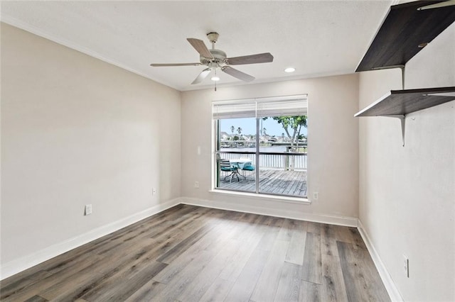 118 Weatherly Cv, Slidell, LA 70458 - empty room featuring wood finished floors, baseboards, recessed lighting, a ceiling fan, and a water view