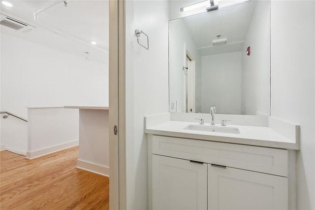 822 N Rampart St Unit 301, New Orleans, LA 70116 - bathroom featuring vanity, wood finished floors, and baseboards