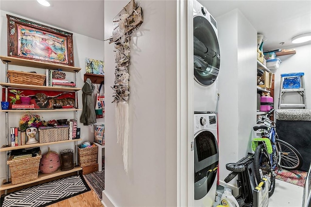 822 N Rampart St Unit 301, New Orleans, LA 70116 - laundry area with estacked washer and dryer and wood finished floors